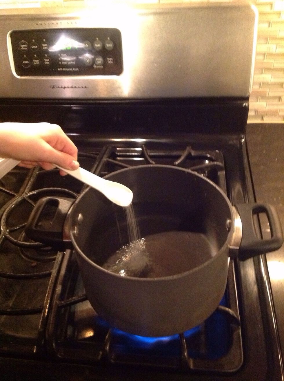 Add a pinch of salt and some grated nutmeg into the boiling water.