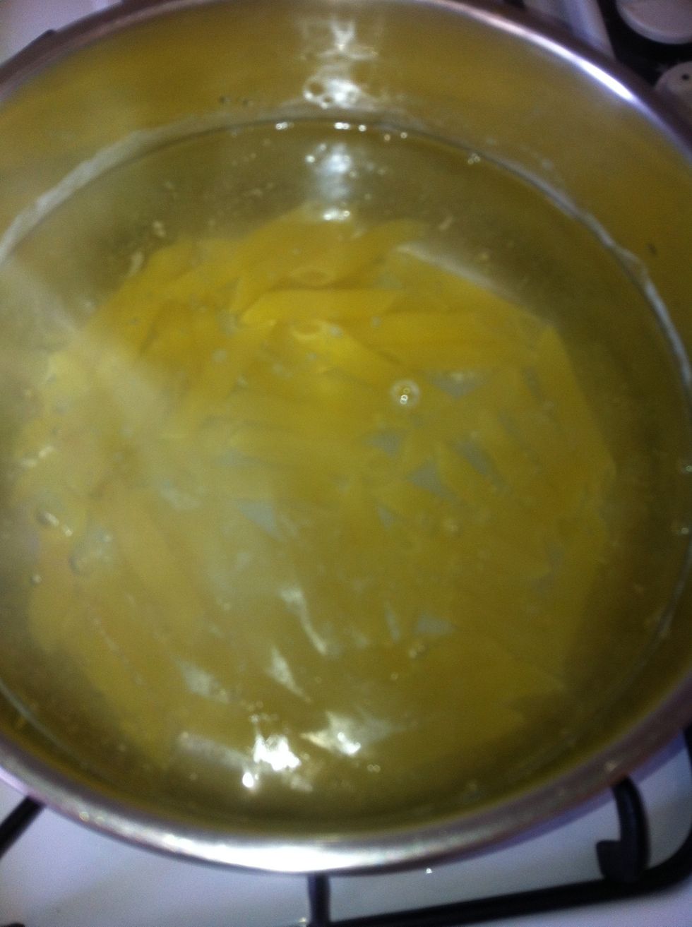 Add a pinch of salt and the pasta to the water