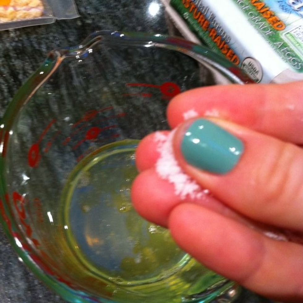 Add a pinch of salt to the egg whites