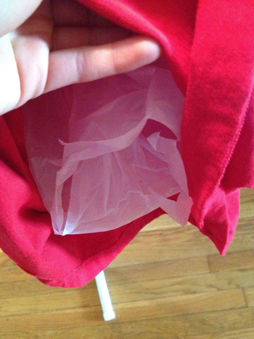 Add a plastic bag, piece of cardboard or other barrier inside the shirt to prevent bleaching on the other side.