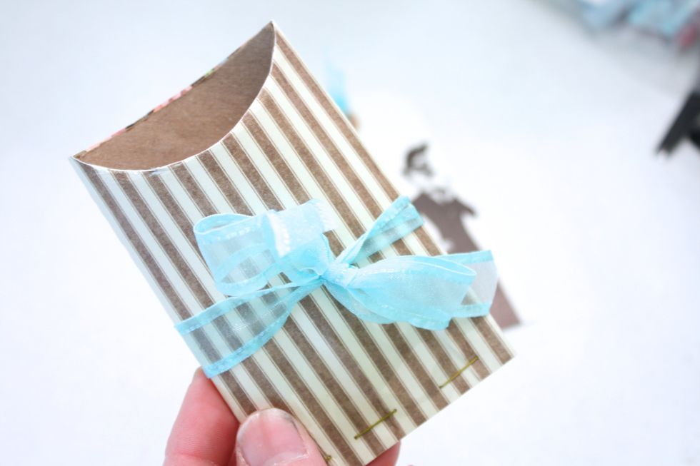 add a pretty ribbon- this one is from may arts. Now you can slip a gift card, a party ticket, a thank you card, gum packs, candy sticks, or anything inside