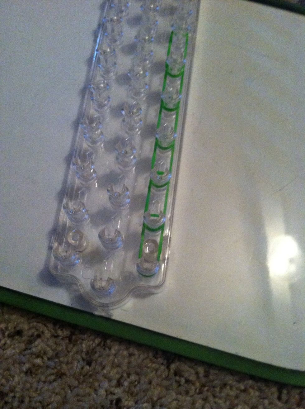 Add a row of green to the loom.