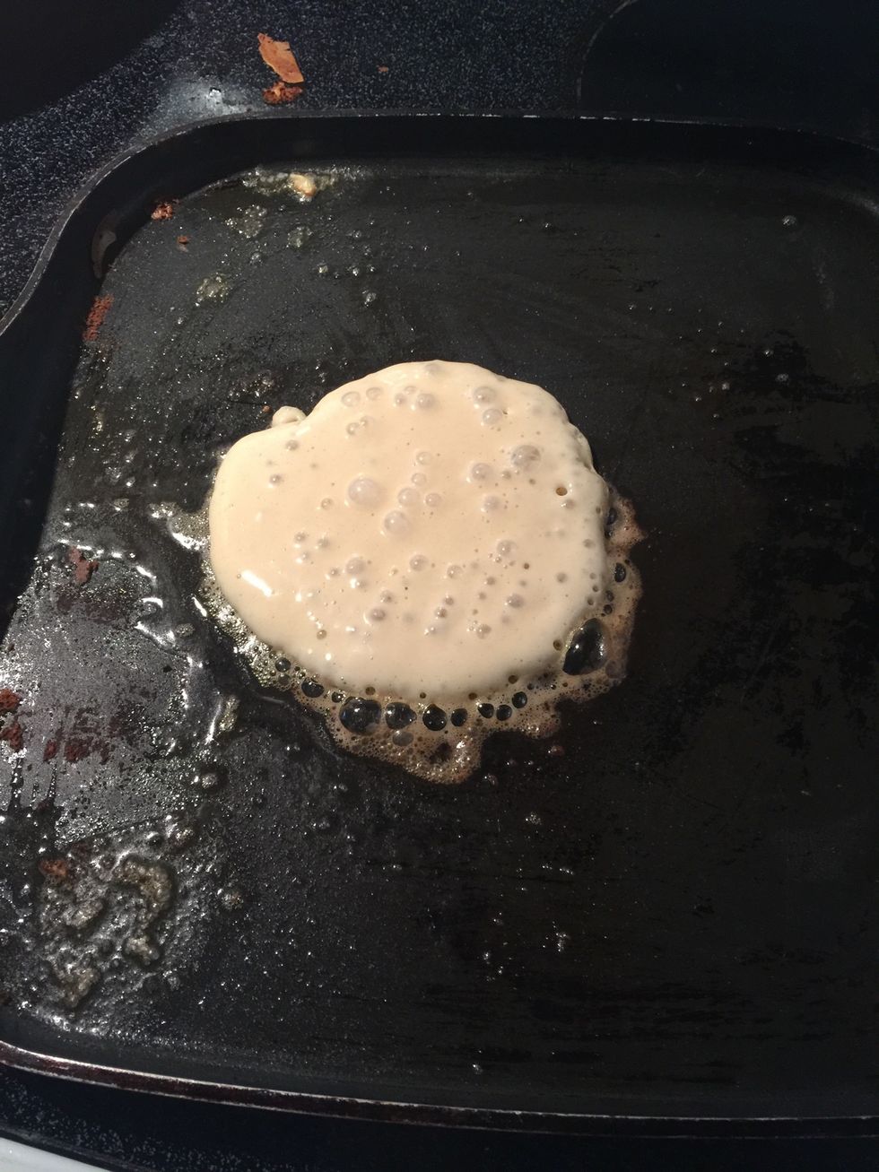 Add a scoop of the batter. Flip when there are bubbles at the top middle of the pancakes.