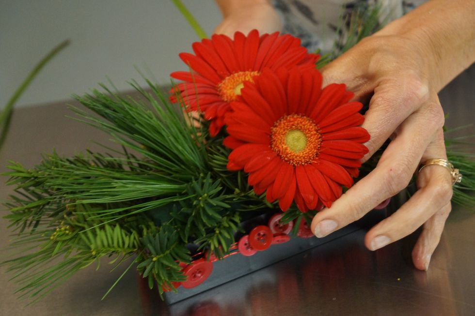 Add a second gerbera close to the first.