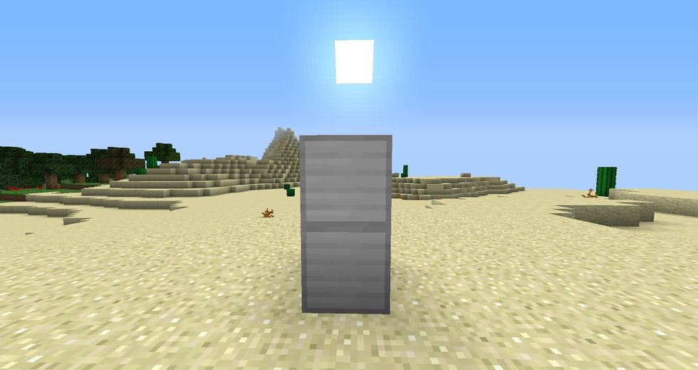 Add a second Iron Block on top of the single iron block on the ground.  Make sure no other Iron Blocks are touching both blocks
