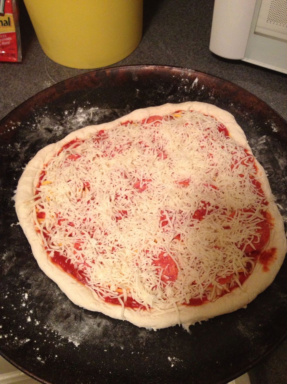 Add a second layer of cheese that covers toppings