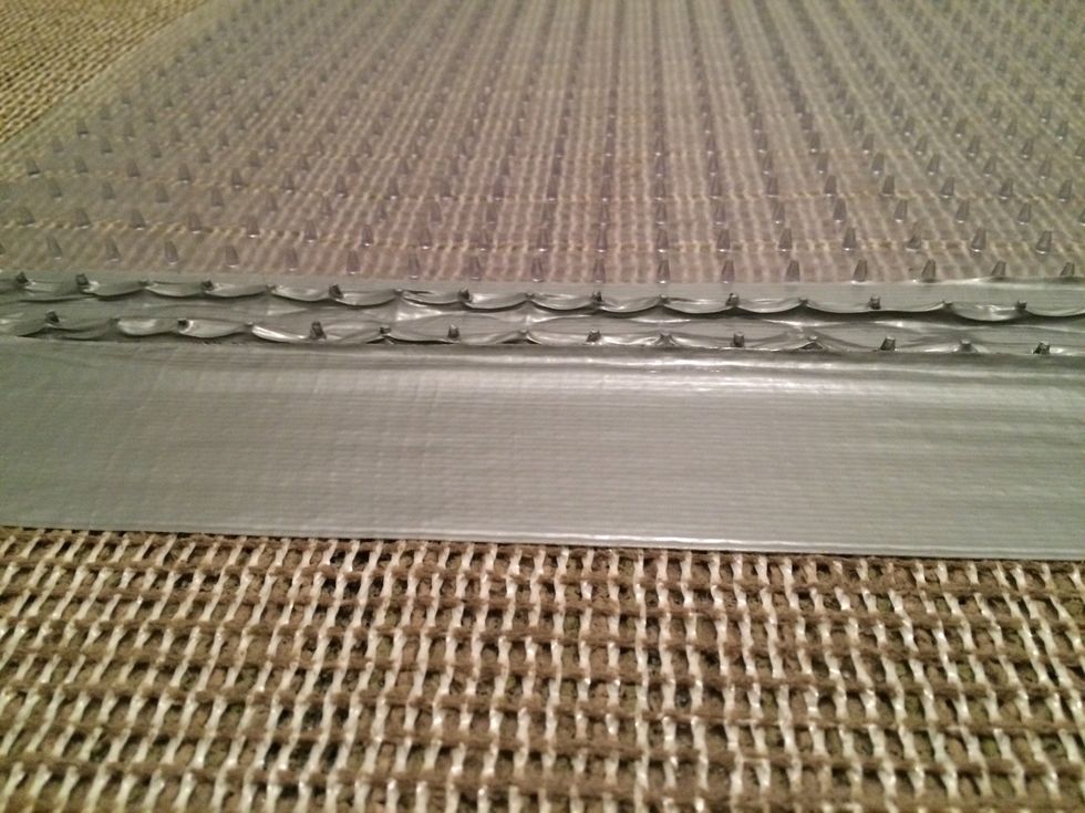 How to secure an area rug over carpet B+C Guides