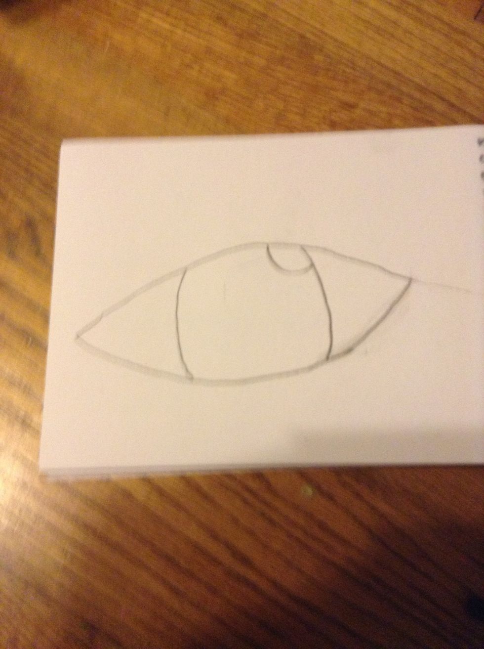 Add a semi circle in the top corner of the eye
