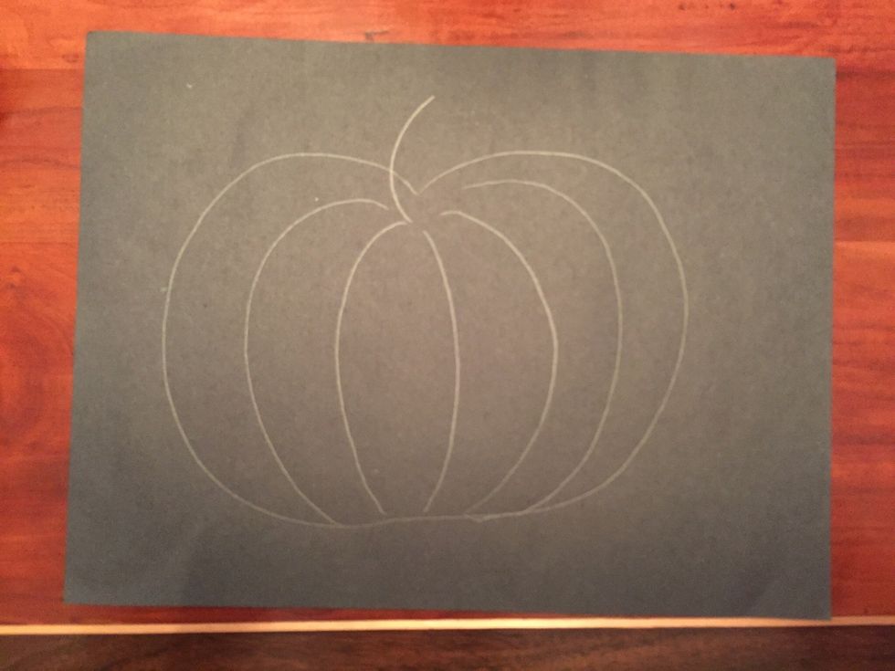 Add a short curved line at the top of your pumpkin.