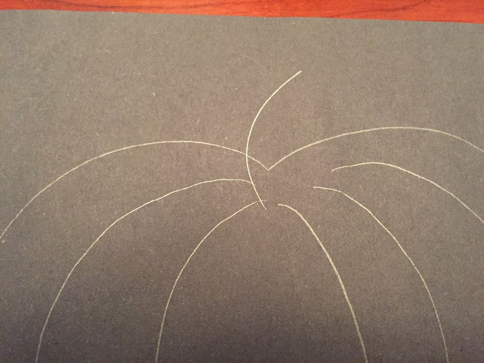 Add a short curved line at the top of your pumpkin.