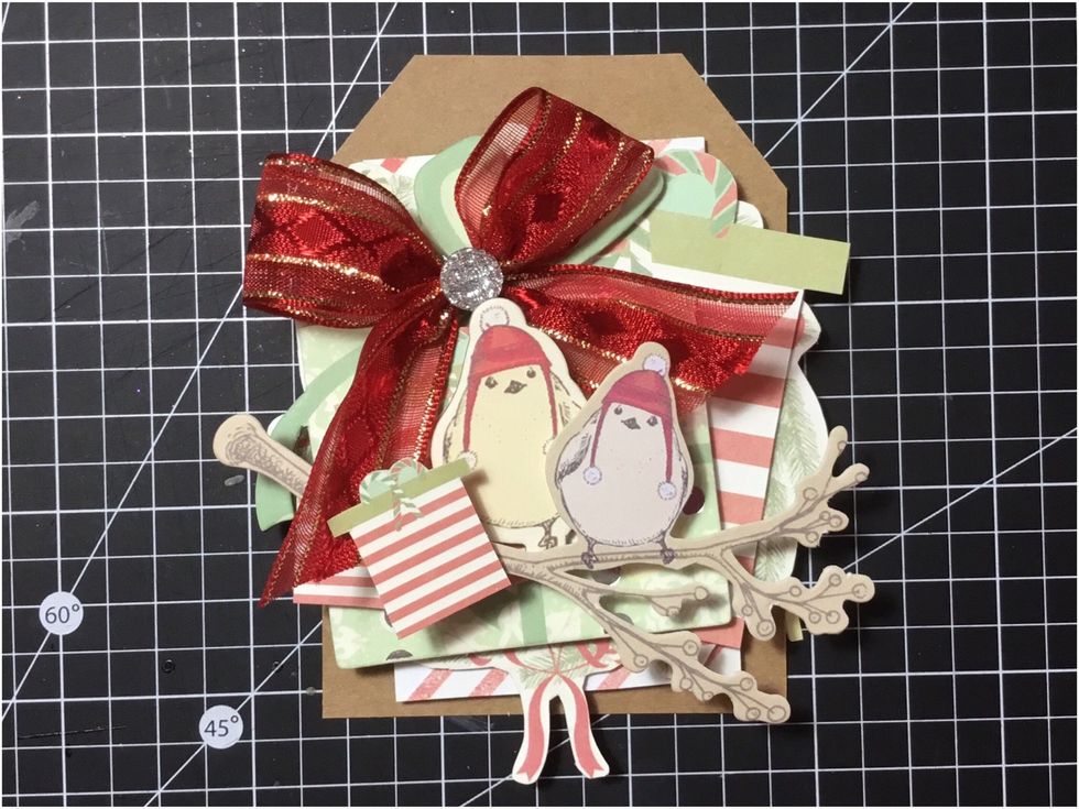 Add a silver Sweet Peppermint Say It In Crystals to the top of the bow, as shown.