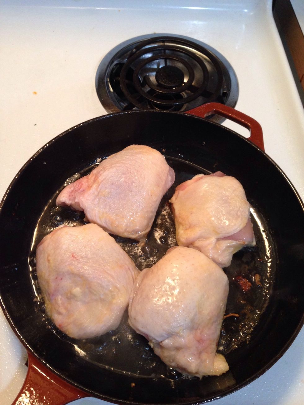 Add a small amount of olive oil, set the stove heat to medium and oven heat to 425. When the pan is hot. add the chicken by laying down away from you.
