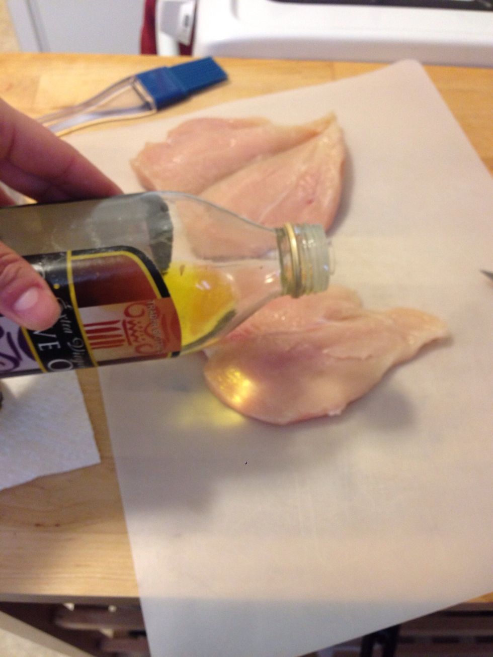 Add a small amount of olive oil to each breast.