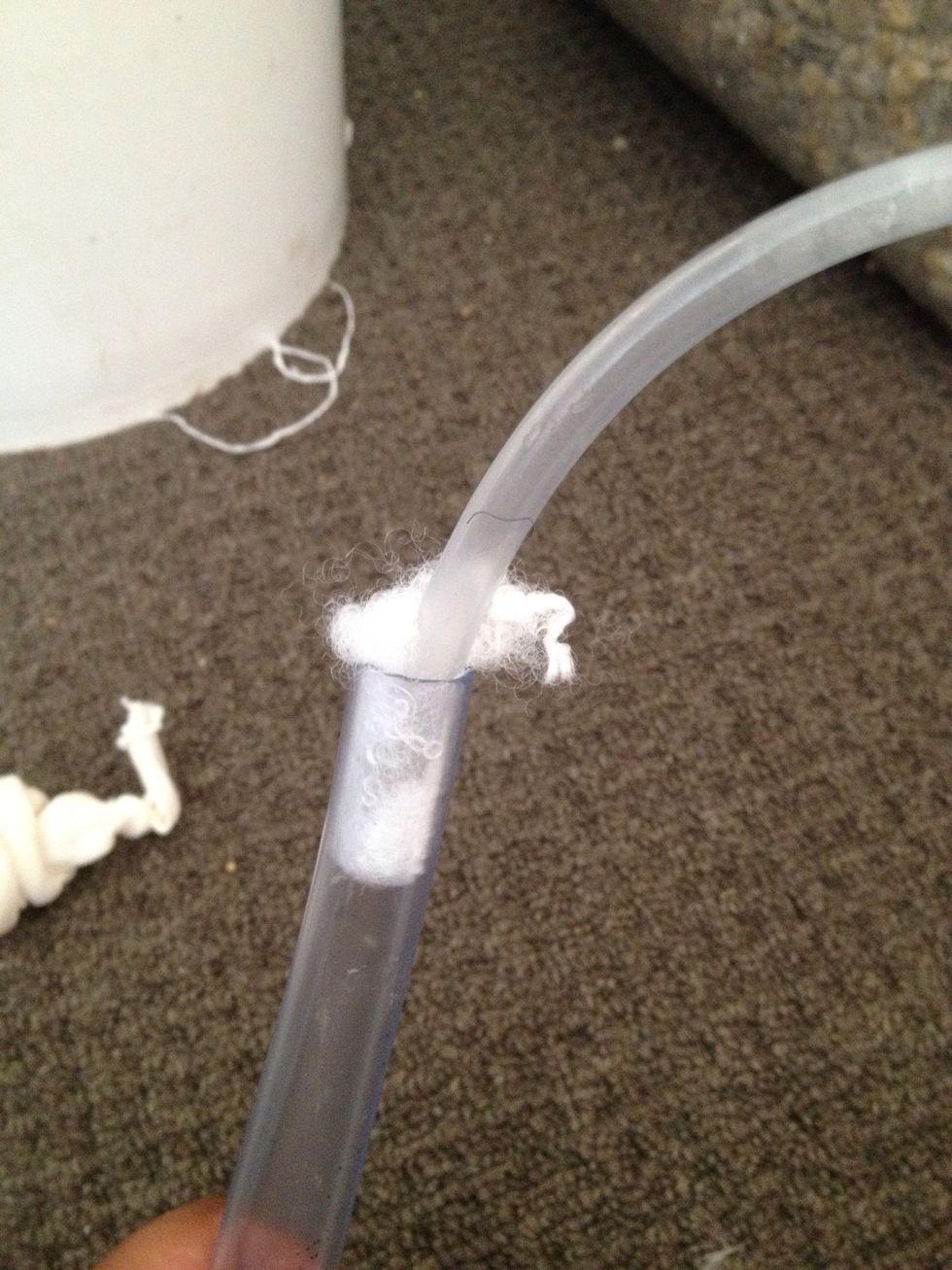 Add a small amount of stuffing to the large tube