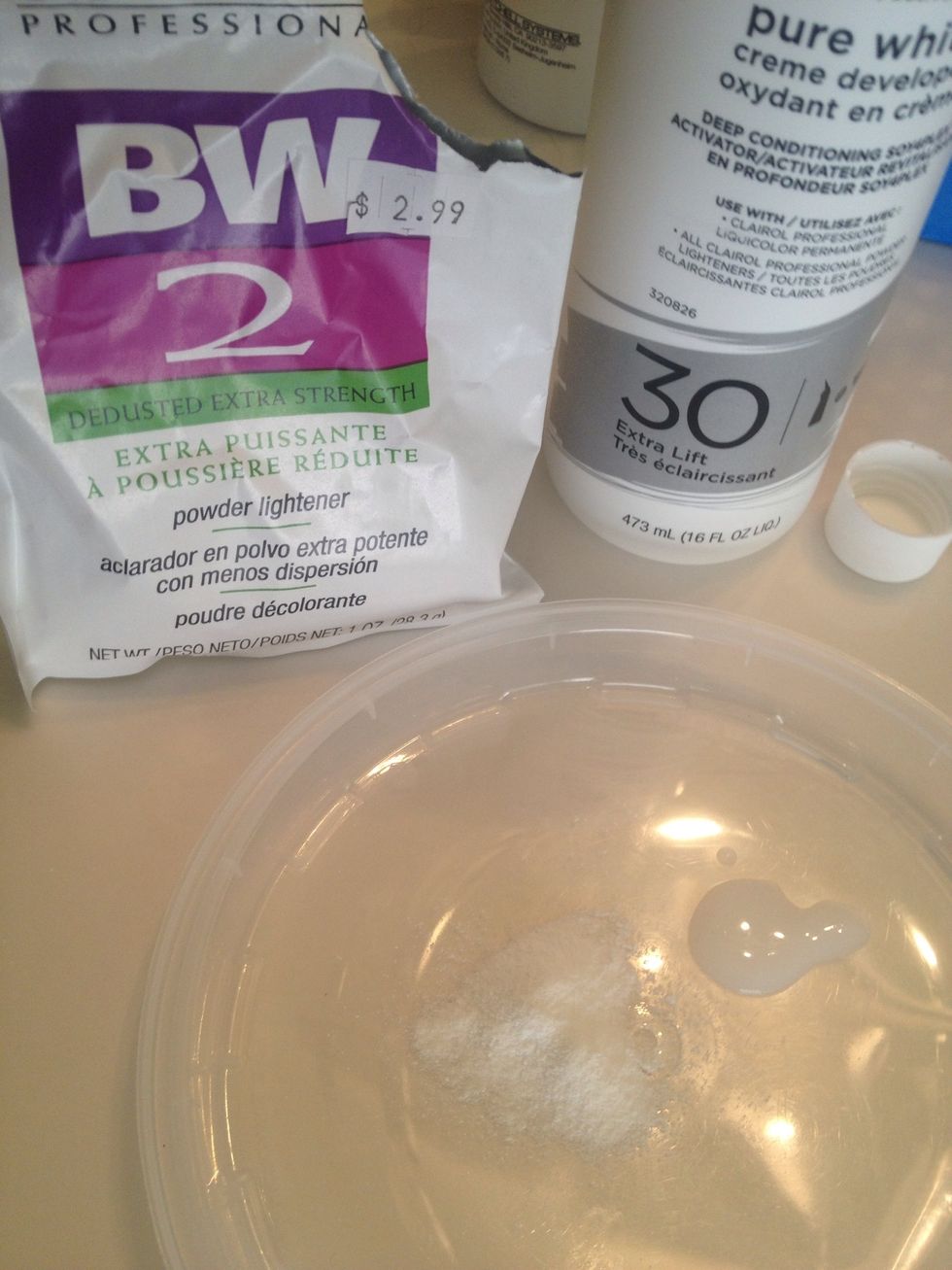 Add a small amount of the Powder Lightener and the Developer to your container.