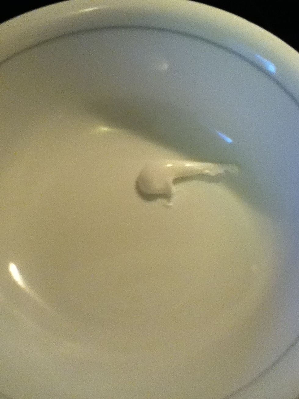 Add a small amount of toothpaste to bowl.