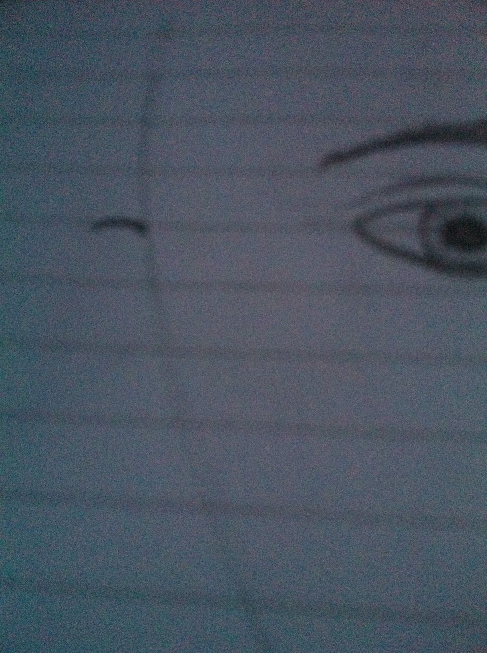 Add a small arc in line with the eyes for the ears