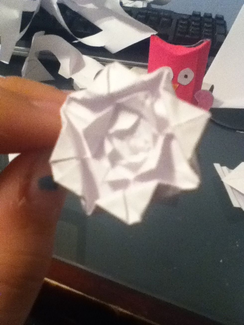 Add a small hole in the middle using a pen or pencil