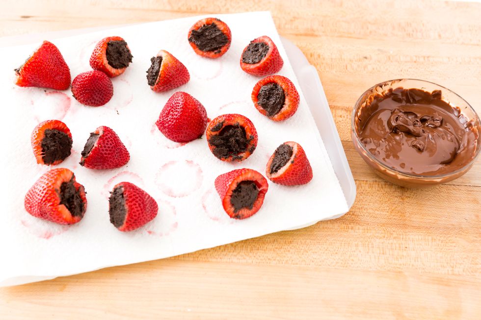 Add a small spoonful of Oreo truffle in each strawberry.