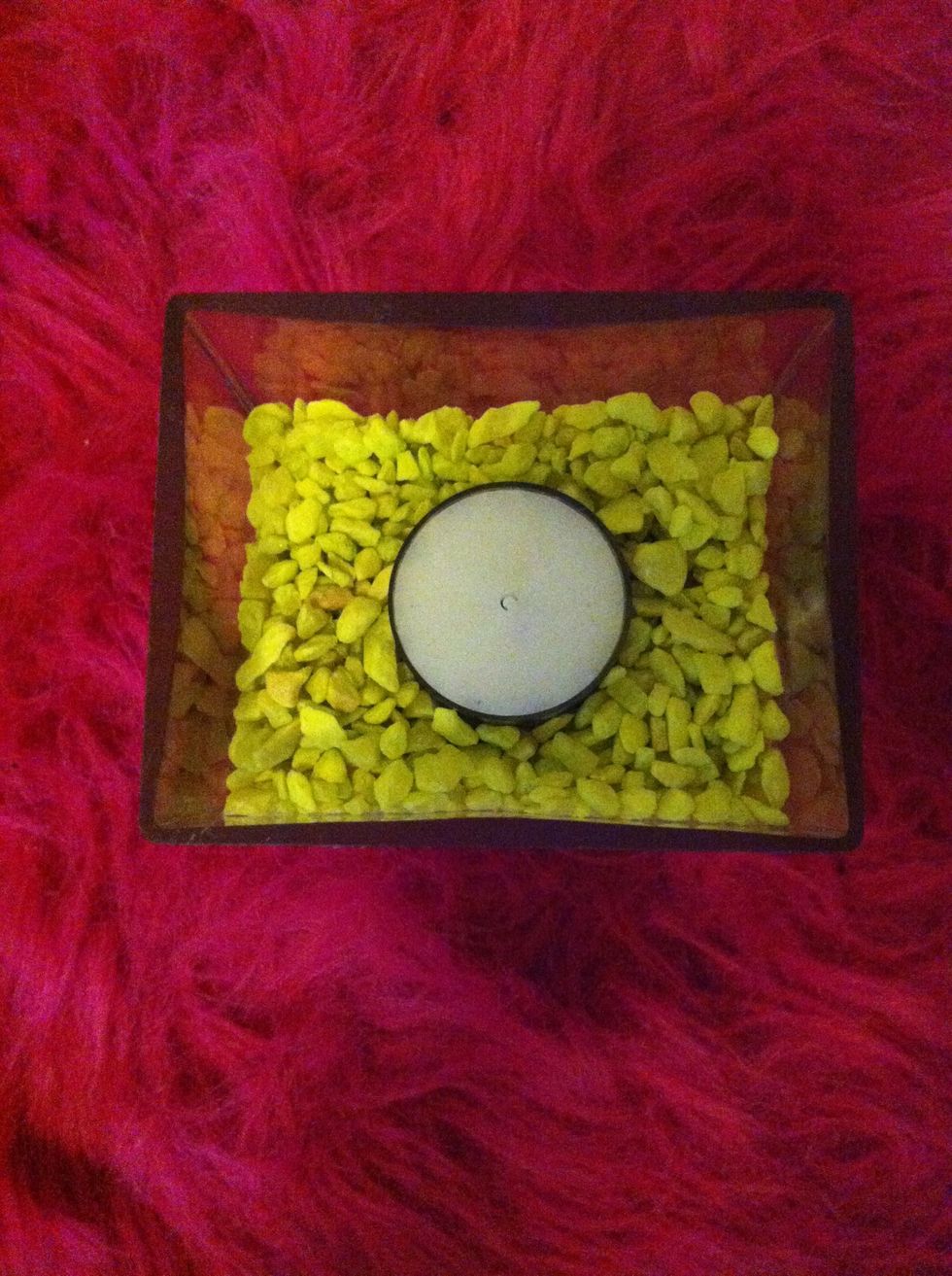 Add a small tea light candle to the rocks.