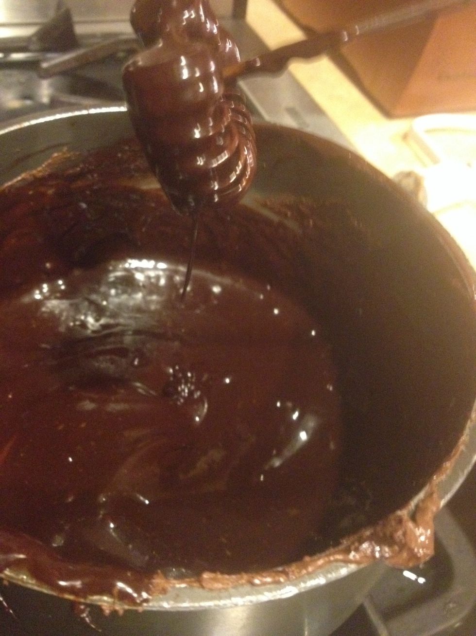 Add a splash of milk until it gets a smooth, fairly thin texture not like a Saucy texture but a little thicker than that, thin enough for drizzling