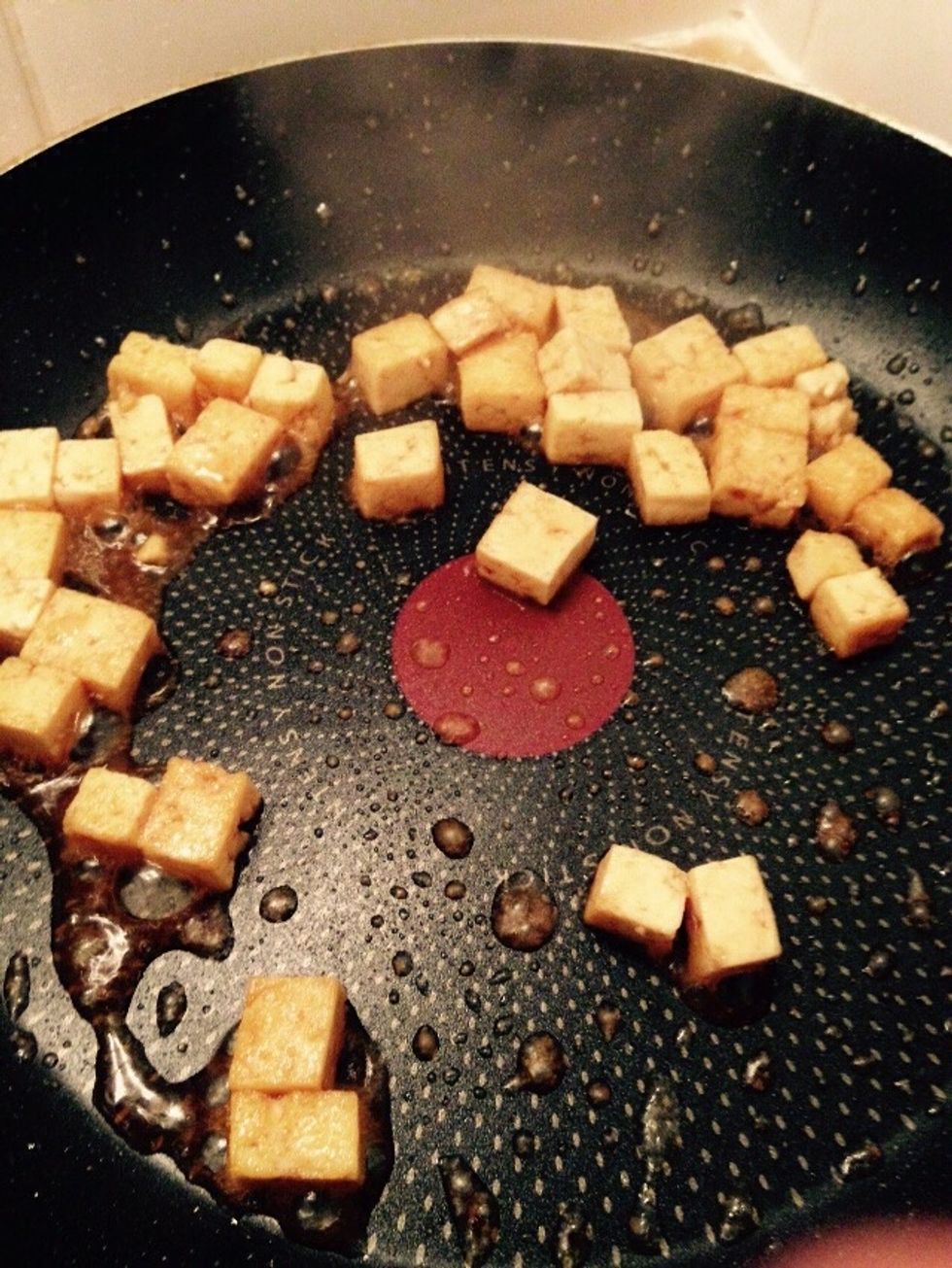 Add a splash of soy sauce and saut\u00e9 the tofu, don't let it burn, then set aside