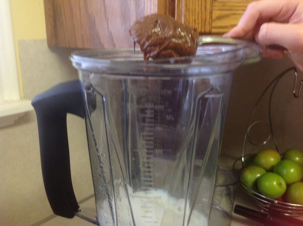 Add a spoonful of Nutella to the blender. You can add more Nutella to make it taste more like Nutella!