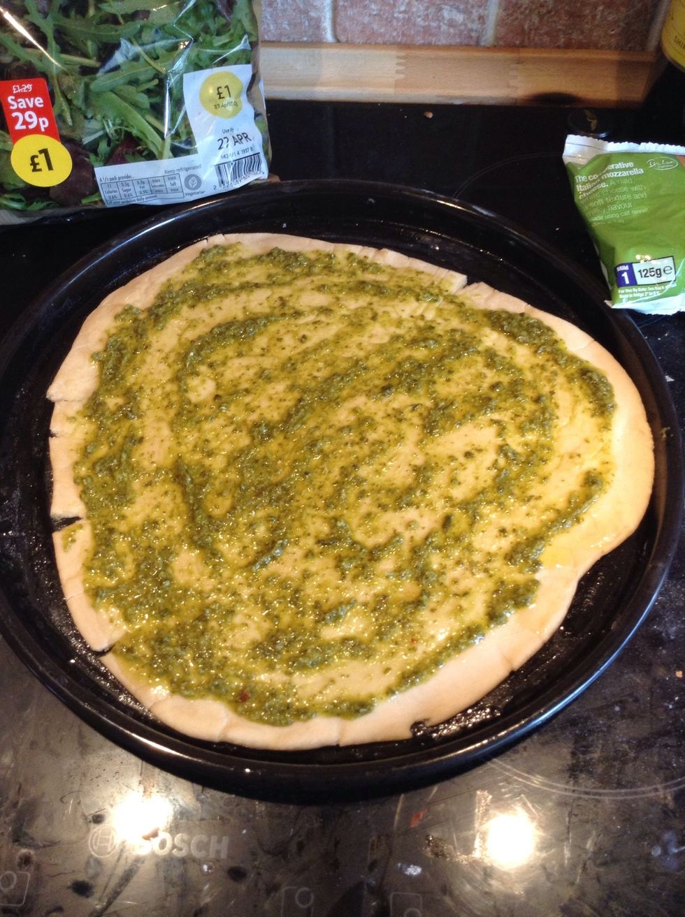 Add a spoonful of pesto and spread it over with the back of a spoon