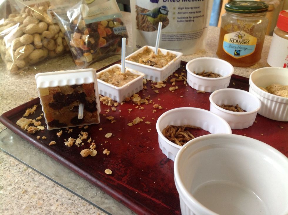 Add a straw to each one to make a hole for threading cord later on.