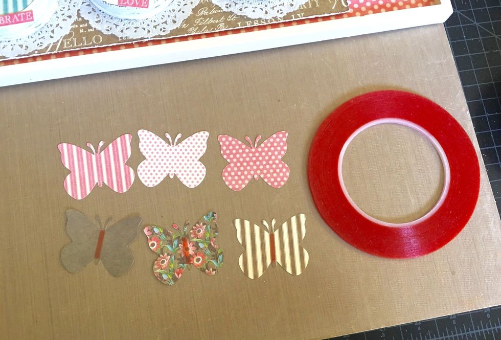 Add a strip of sticky redline tape (or ScorTape if you have it) to the center (backside) of 3 butterflies as shown above.