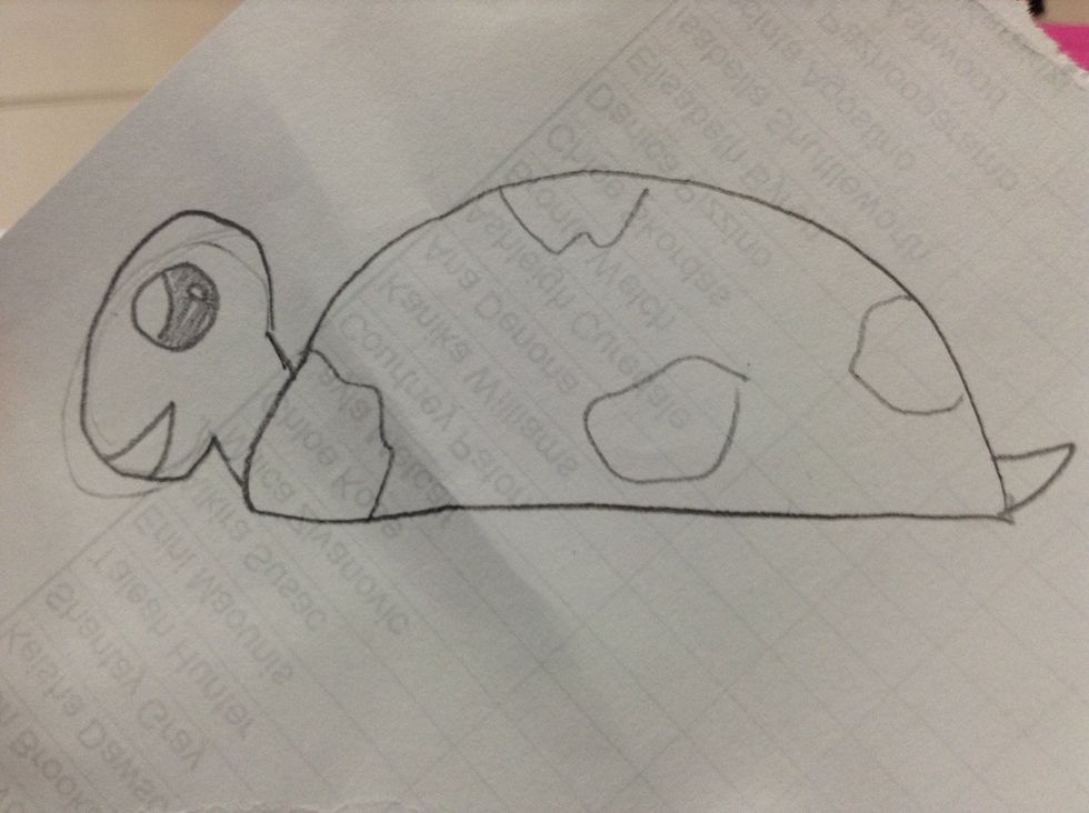 Add a tail at the back of the semi circle and add some patches on the shell.