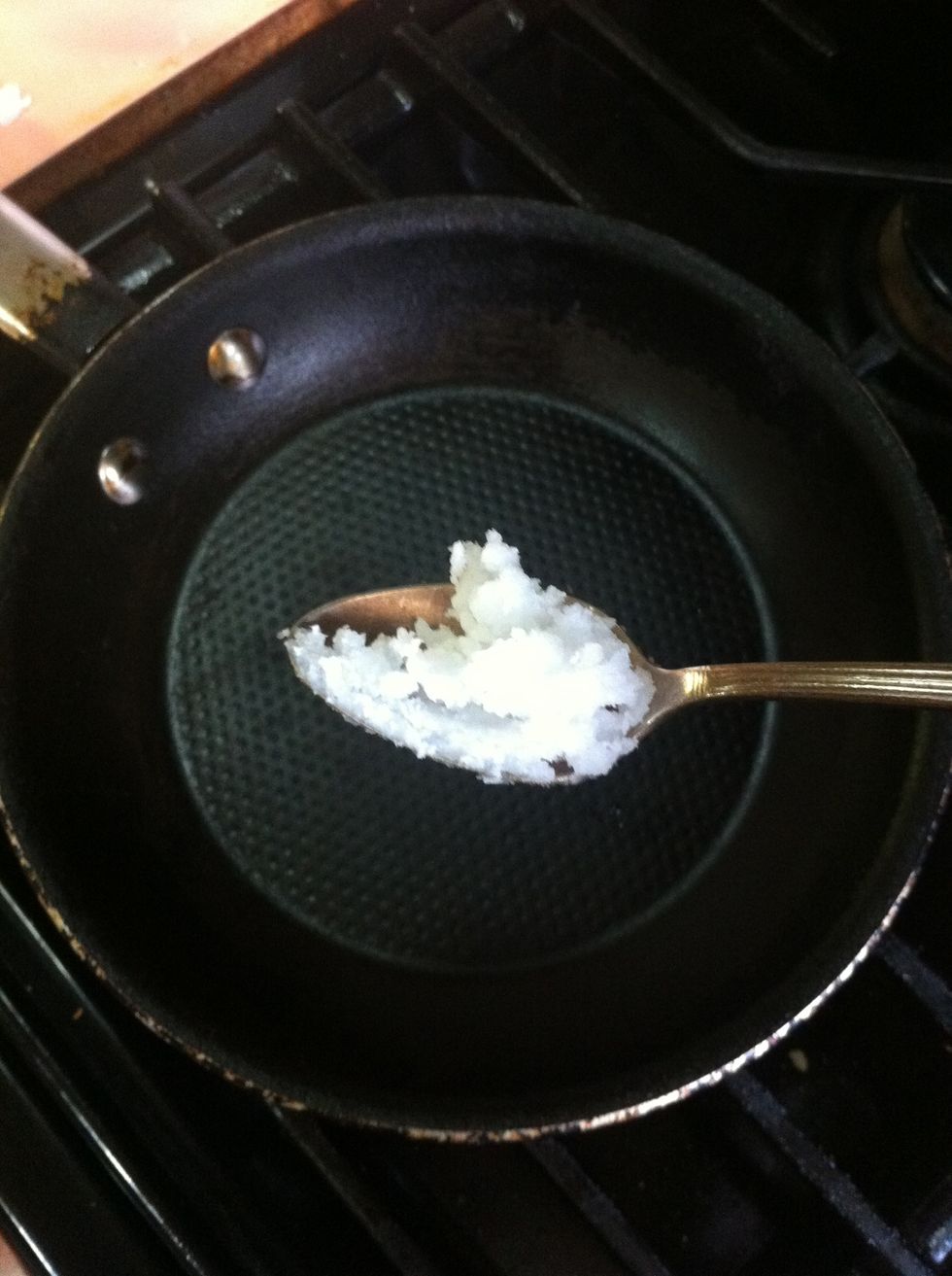 Add a teaspoon of coconut oil into a hot pan.