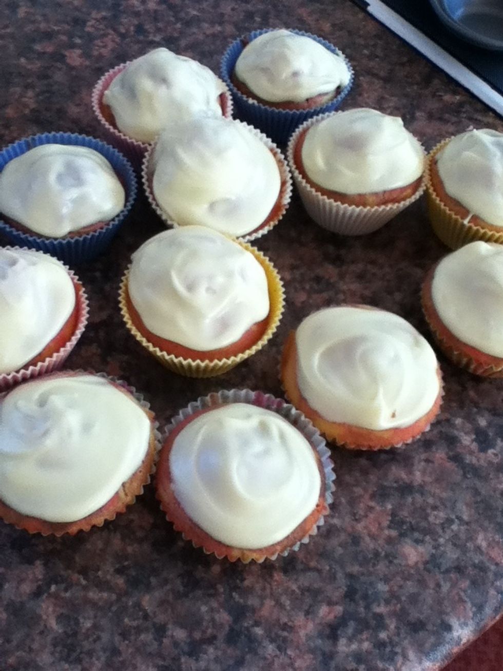 Add a teaspoon of icing to each cake and smooth down with the back of the spoon.