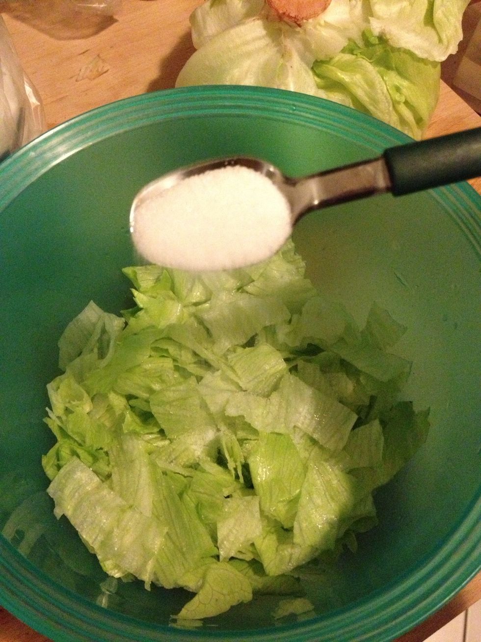 Add a teaspoon of sugar. Or two.. it depends on your taste and the amount of salad.