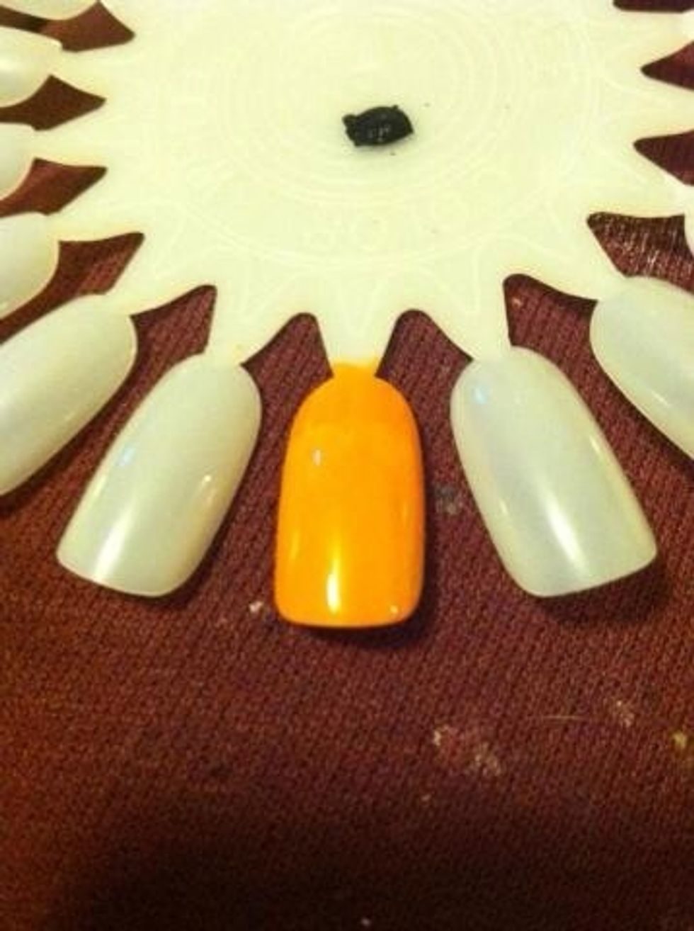 Add a thin layer of orange. (You can also use a sponge and do the gradient thing.) Add some sparkles (if you want. Looks good either way).