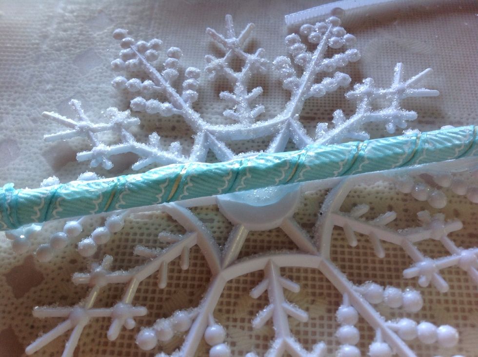 Add a thin line of glue over top of dowel.