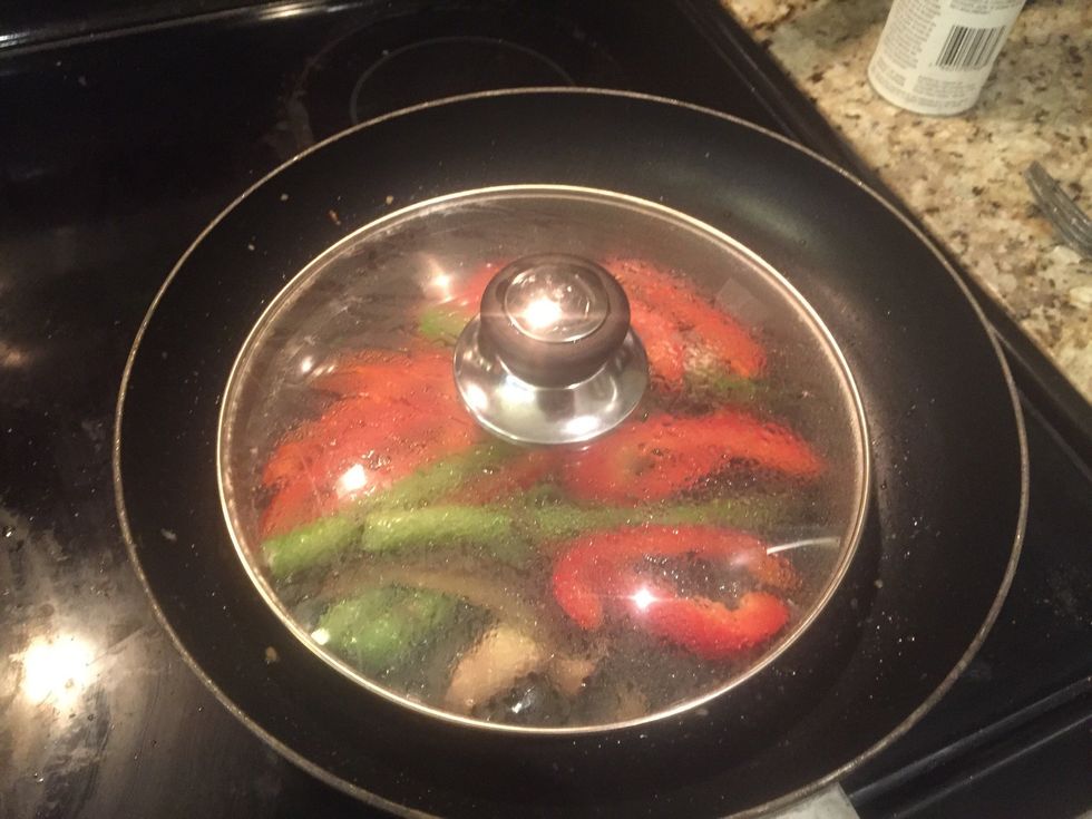 Add a tiny bit of water and the optional dried chilli flakes and let steam.