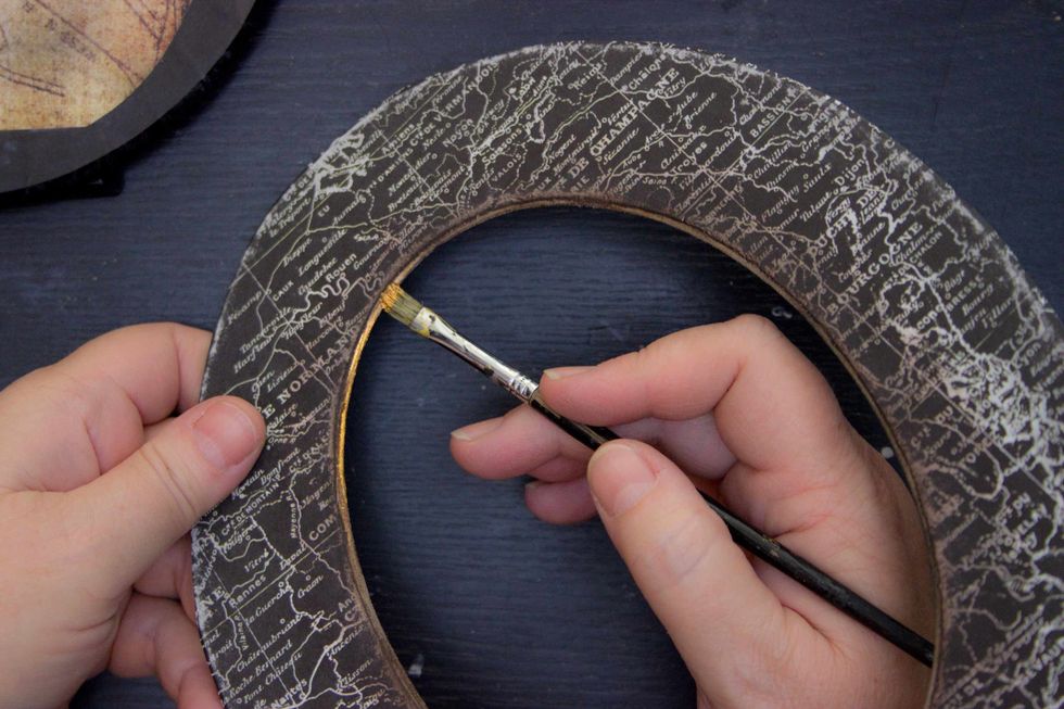 Add a tiny rim of Metallique "Steampunk Copper" to the inner bevel of the Matte: