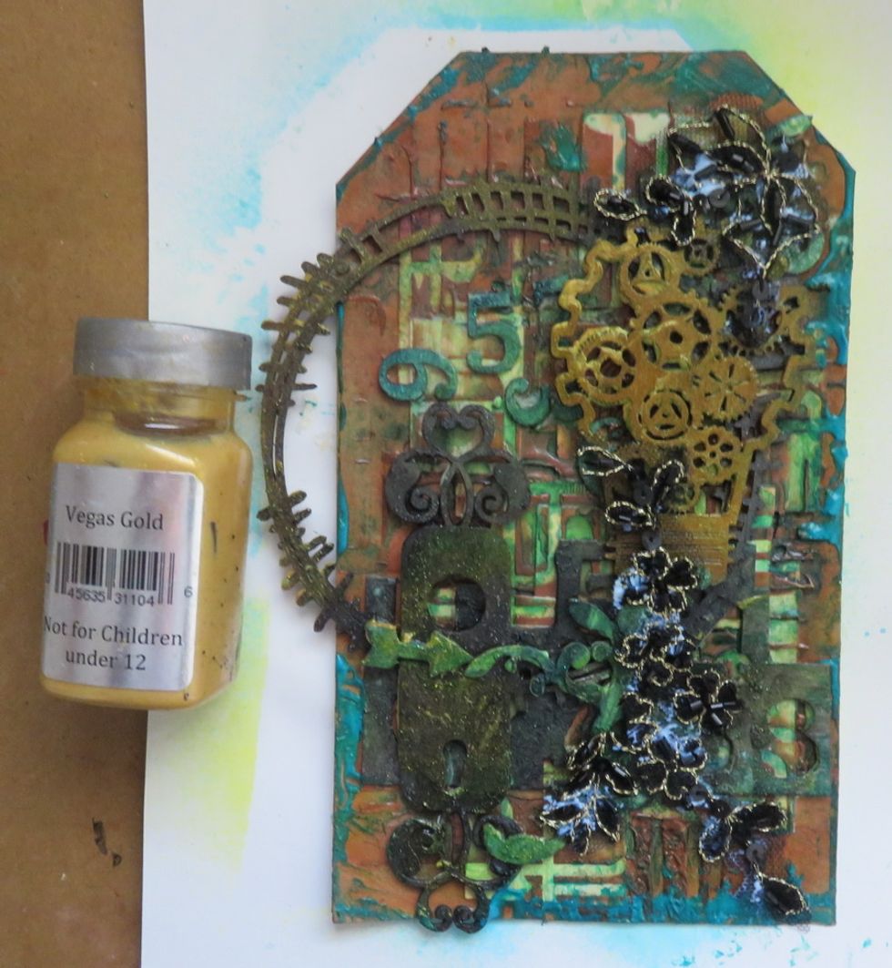 Add a touch of Vwgas Gold over the chipboards.