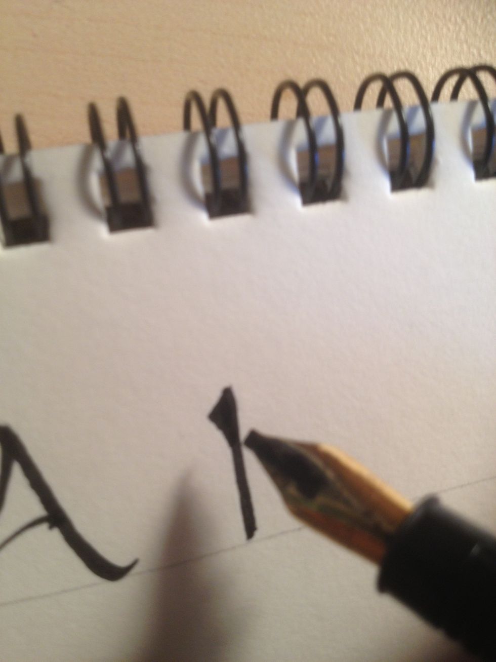 Add a triangle embellishment to the top; this is how most of the trunks in this alphabet will look.