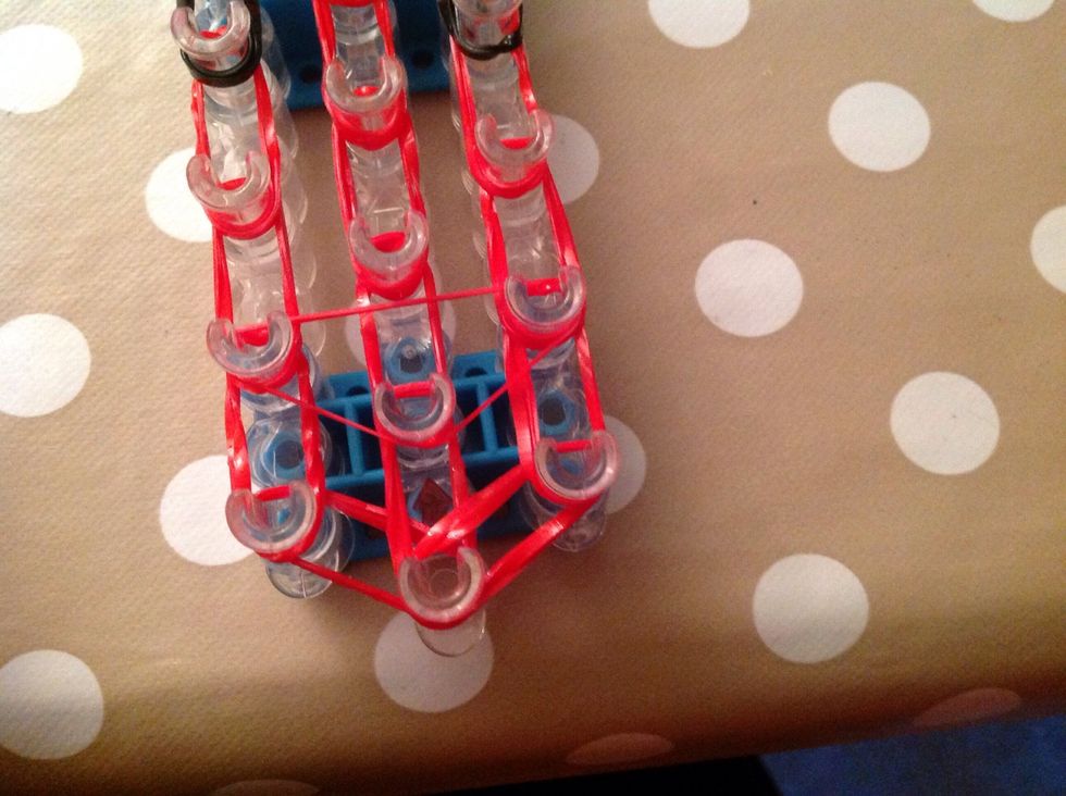 Add a triangle, using one band, starting from the second peg up.