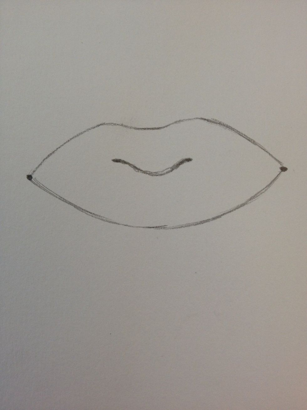 Add a u-shape between the two middle dots.