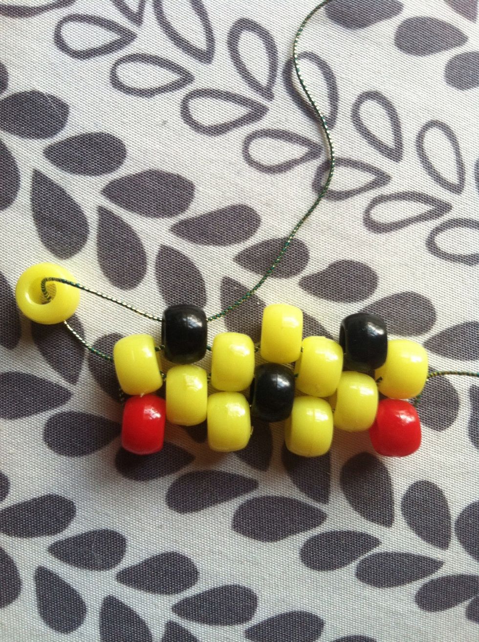 Add a yellow then thread it through the black.