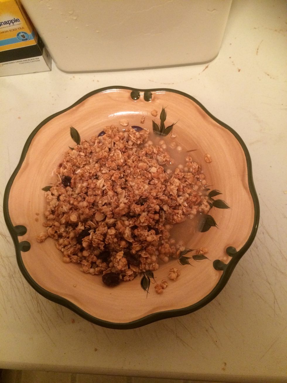 Add about 1/2 cup of water to the granola and stir it to make sure all the granola gets wet.
