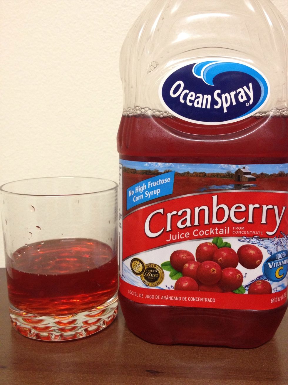 Add about 1-2 ounces of Cranberry Juice into your glass.