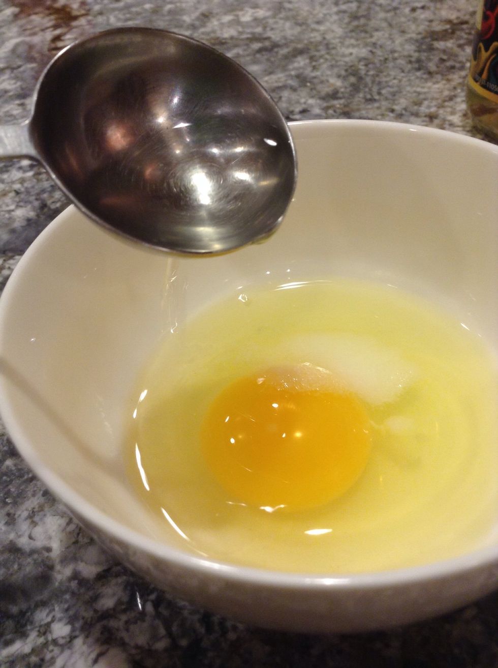 Add about 1 tablespoon of vinegar to the egg