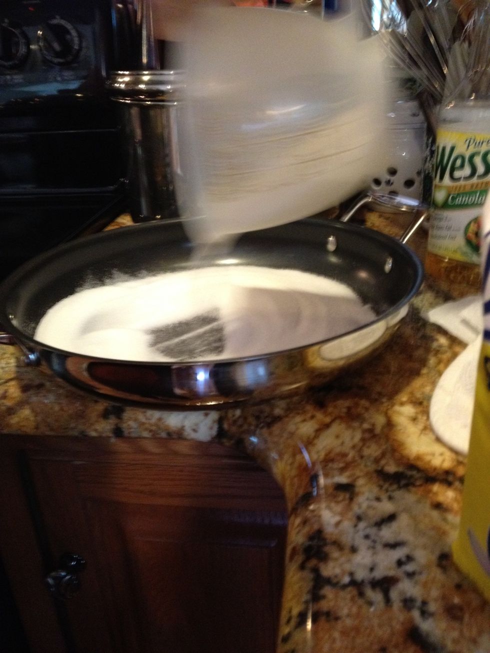Add about 1 to 1 1/4 cup of cane sugar to a non stick pan and turn on heat to melt sugar
