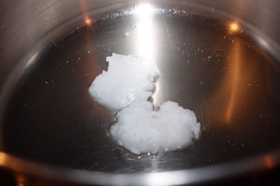 Add about 2 tablespoons or so to a large pot and melt over medium heat