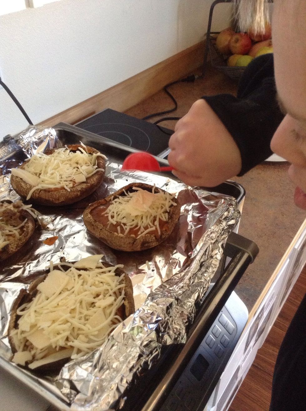 Add about 3 tablespoons of the cheese mixture to each of the mushroom caps