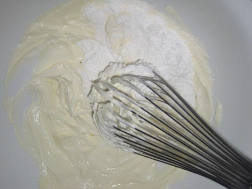 Add about 85gm icing sugar(sifted) and fully beat into the cheese mix.